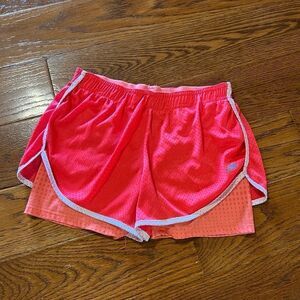 Bright pink and orange athletic shorts by marika tek size small